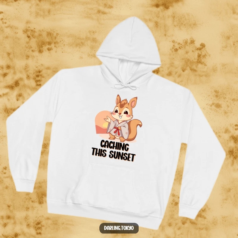 Funny squirrel in a kimono admires a gorgeous sunset, offering warmth and humor in this plush hoodie.
