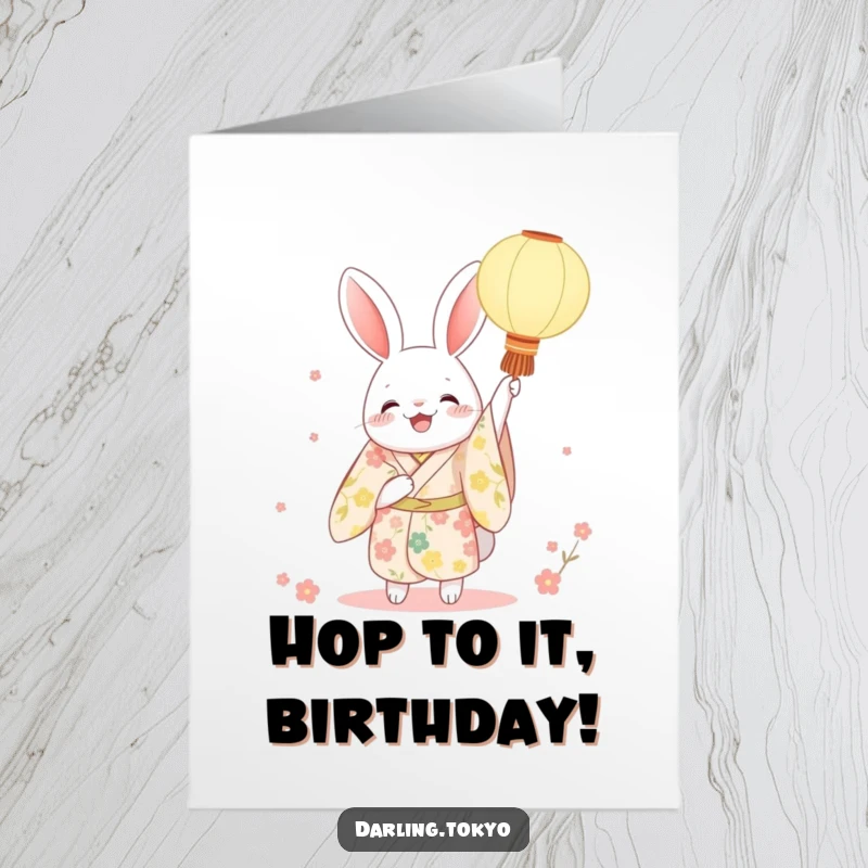 Funny Free Printable Rabbit Birthday Card, a character in a floral kimono joyfully holding up a lit paper lantern, spreading birthday cheer.