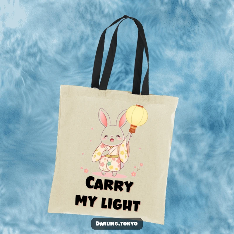 Funny rabbit kimono tote bag with a character joyfully holding a paper lantern aloft, perfect for carrying items with festive and charming flair.